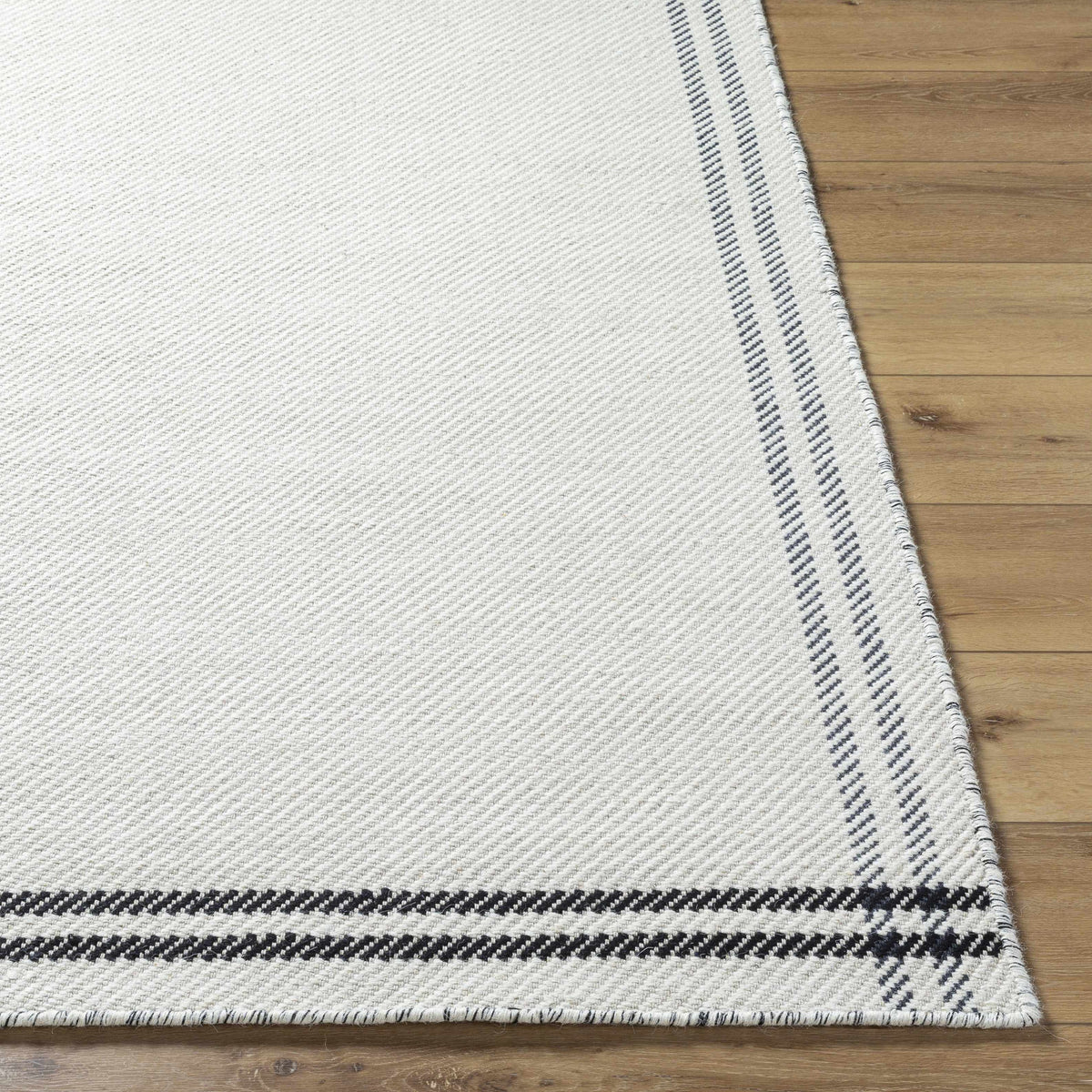 Nimue Cream & Blue Bordered Area Rug - Clearance