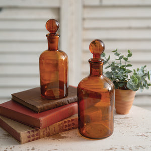 Set of Two Amber Glass Bottles with Stoppers