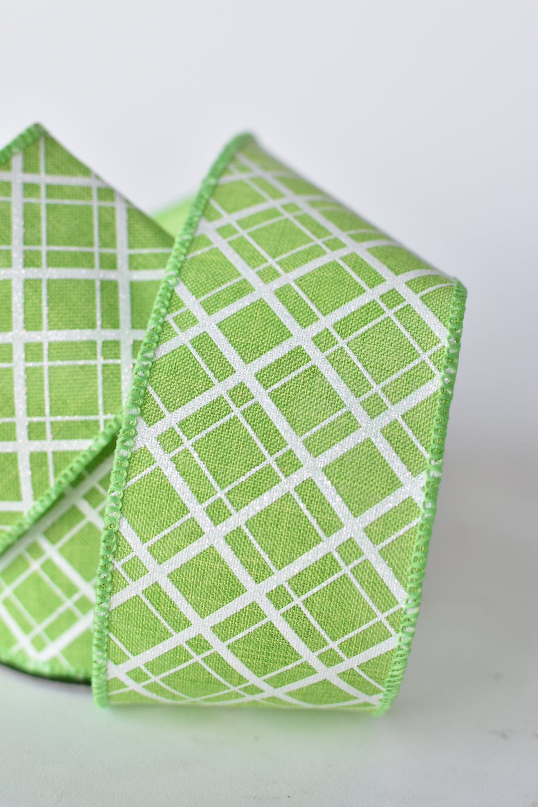 2.5" x 10yd Green and White Glittered Plaid Wired Ribbon